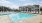 a swimming pool in front of a house