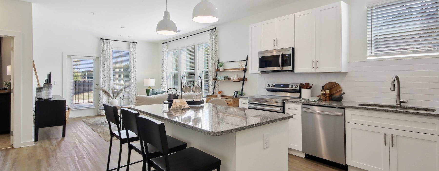 a kitchen with white cabinets