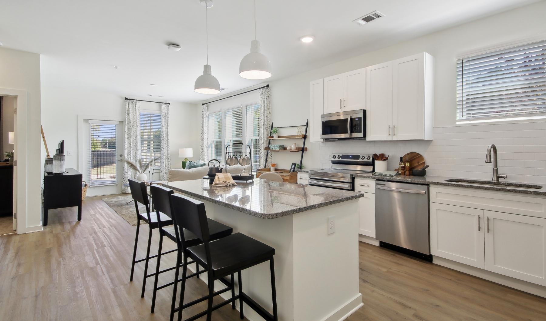 a kitchen with white cabinets