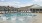 a pool with chairs around it