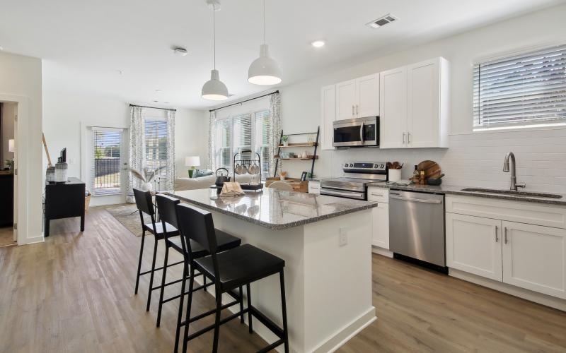 a kitchen with white cabinets