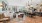 a large room with a bar and chairs