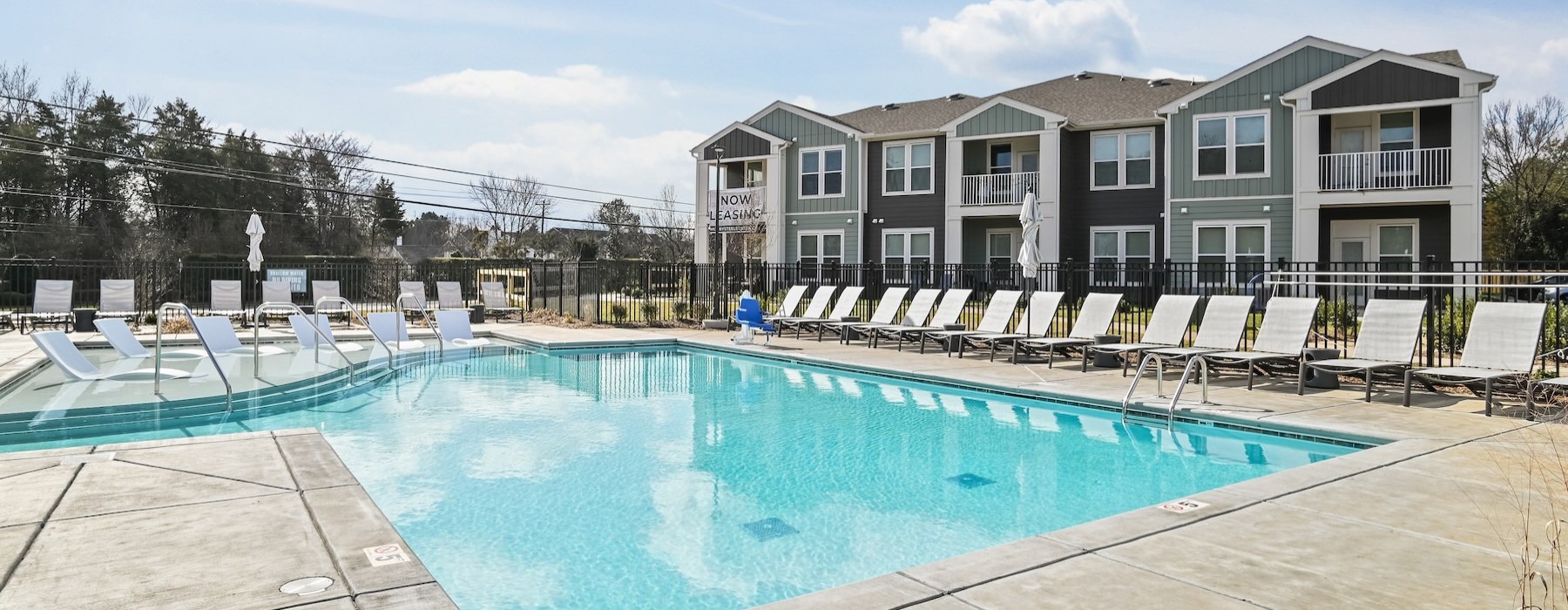 a swimming pool in front of a house