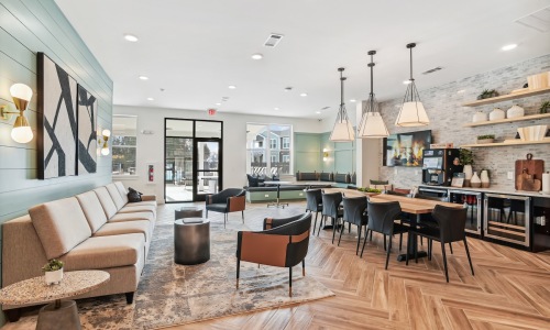 a clubroom with tables and chairs